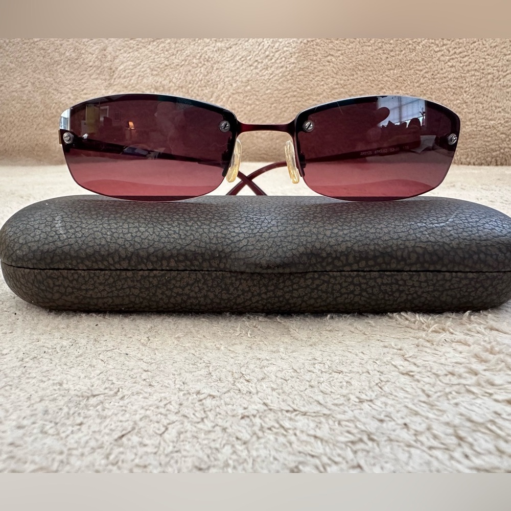 Anne Klein women’s sunglasses.  Burgundy frames with rose colored lenses. Case.